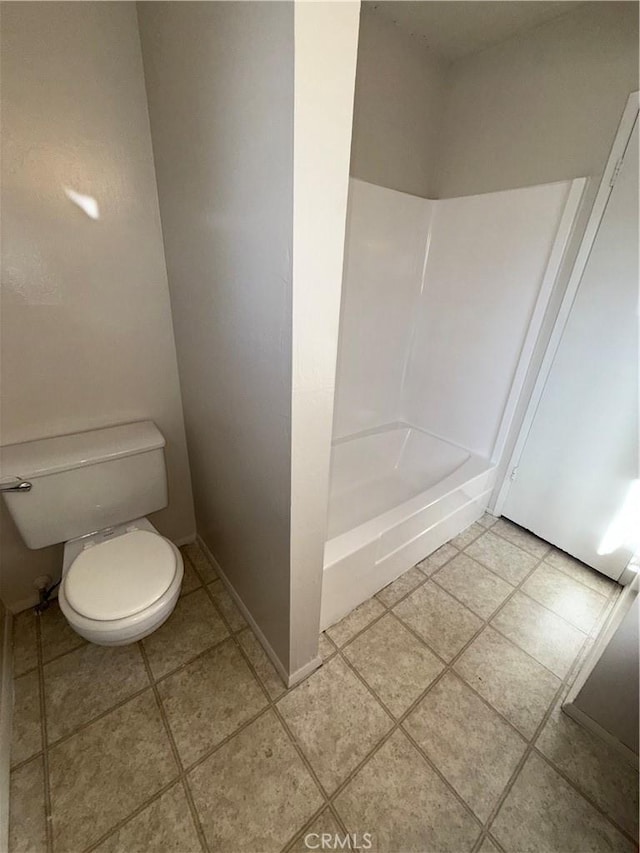 bathroom featuring toilet and bathtub / shower combination