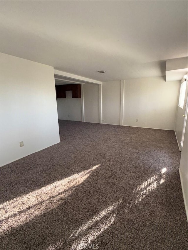 spare room featuring carpet