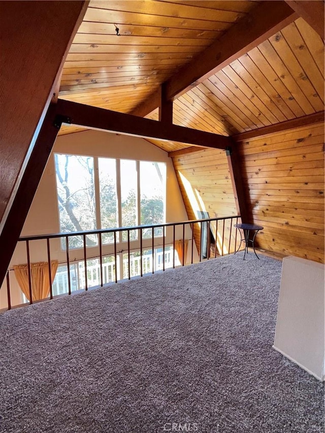 additional living space featuring wood ceiling and vaulted ceiling with beams