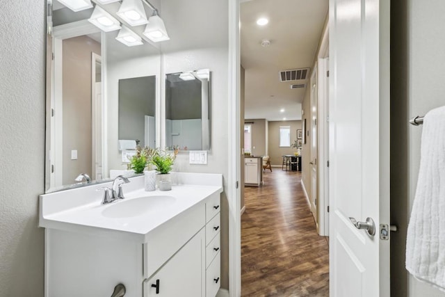 bathroom featuring hardwood / wood-style floors and vanity