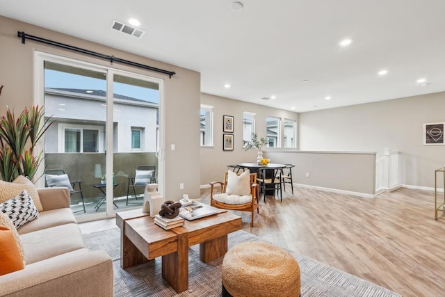 living room with light hardwood / wood-style floors