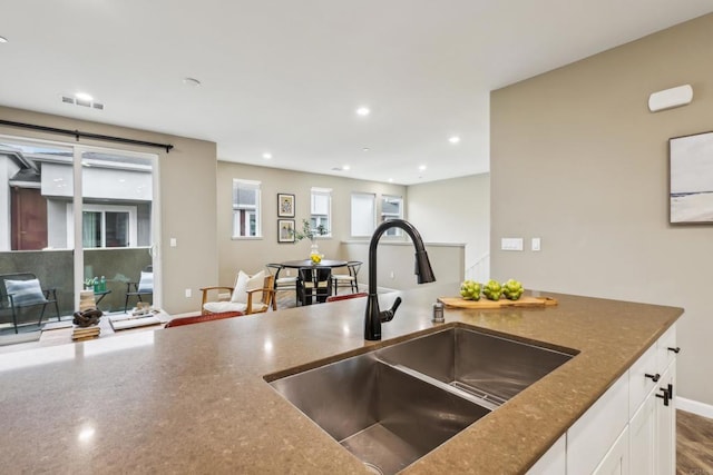 kitchen with sink and white cabinetry