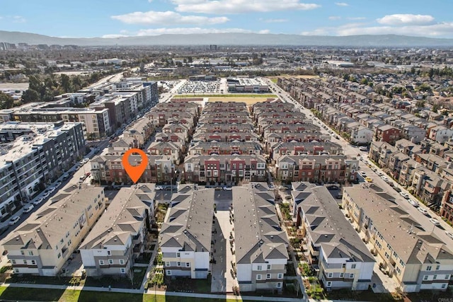 birds eye view of property featuring a mountain view