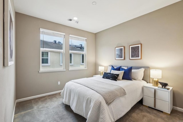 bedroom featuring dark colored carpet