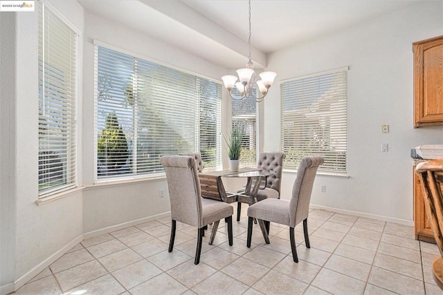 tiled dining area with a wealth of natural light and a notable chandelier