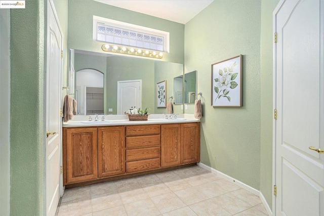 bathroom with vanity and tile patterned flooring