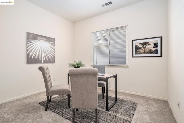 view of carpeted dining space