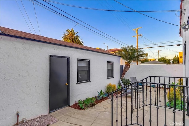 view of side of property with a patio