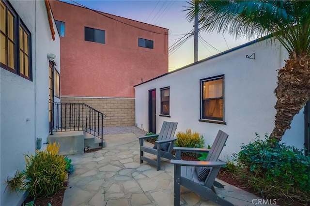 view of patio terrace at dusk