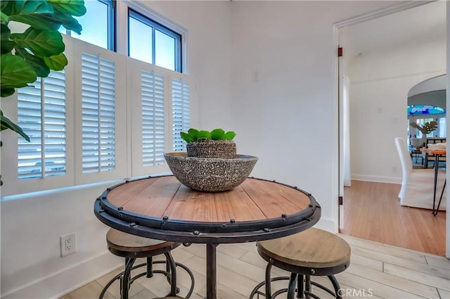 dining space with light hardwood / wood-style flooring