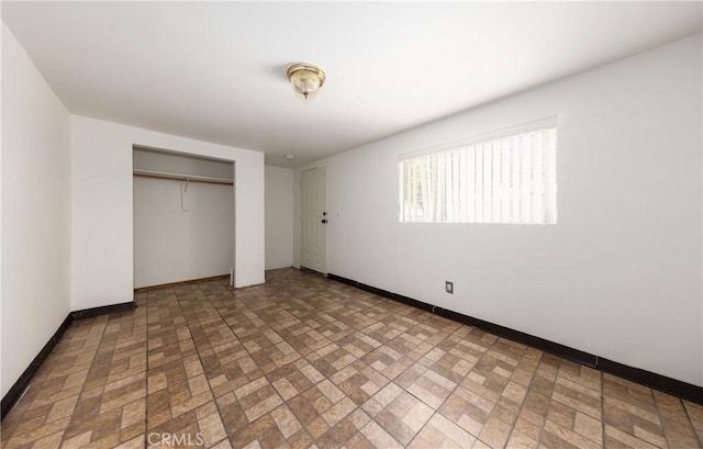 unfurnished bedroom with a closet