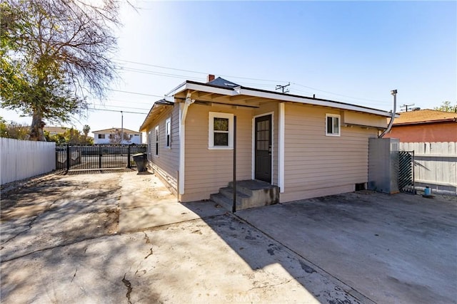 back of property with a patio