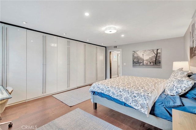 bedroom with wood-type flooring