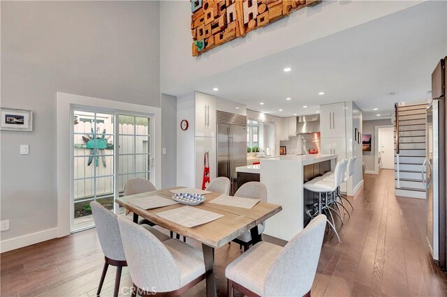 dining area featuring dark wood-type flooring