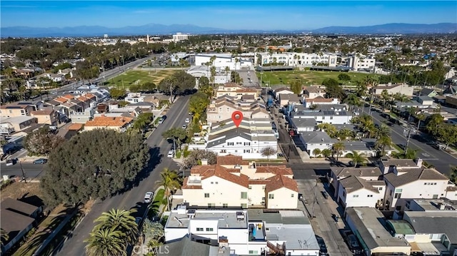 birds eye view of property with a mountain view