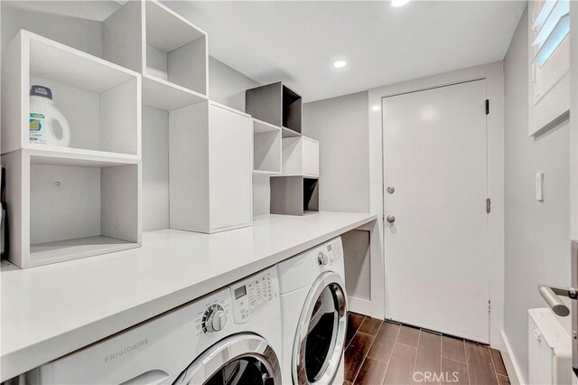 washroom featuring washing machine and dryer