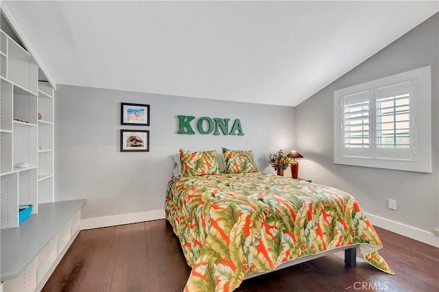 bedroom with dark hardwood / wood-style floors and vaulted ceiling