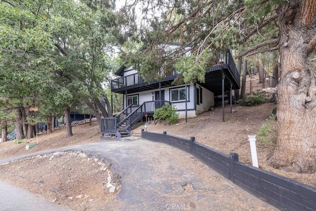 view of front of house with a wooden deck