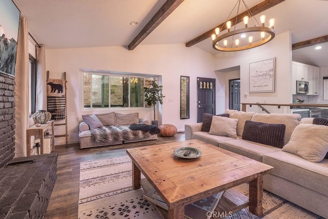 living room with hardwood / wood-style floors, lofted ceiling with beams, and a chandelier