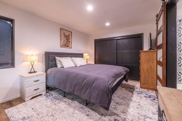 bedroom featuring dark hardwood / wood-style floors