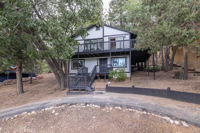 view of front of home with a wooden deck