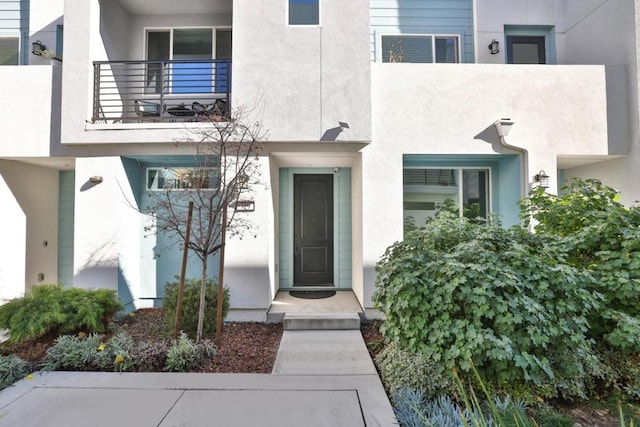 entrance to property with a balcony