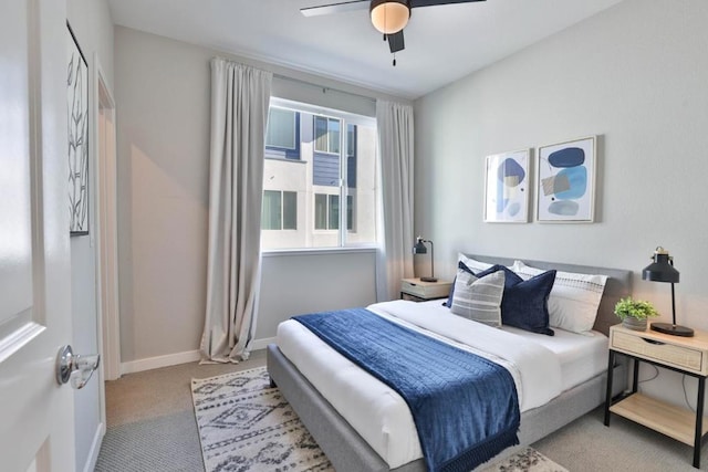 bedroom featuring light colored carpet and ceiling fan