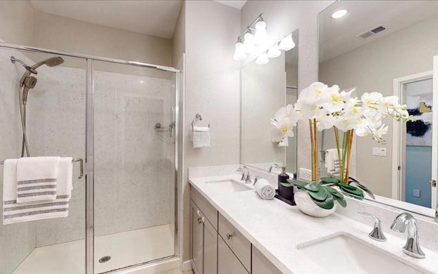 bathroom with vanity and an enclosed shower