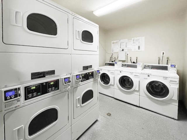 washroom with separate washer and dryer and stacked washer / drying machine