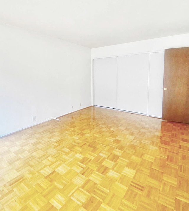 empty room featuring light parquet flooring