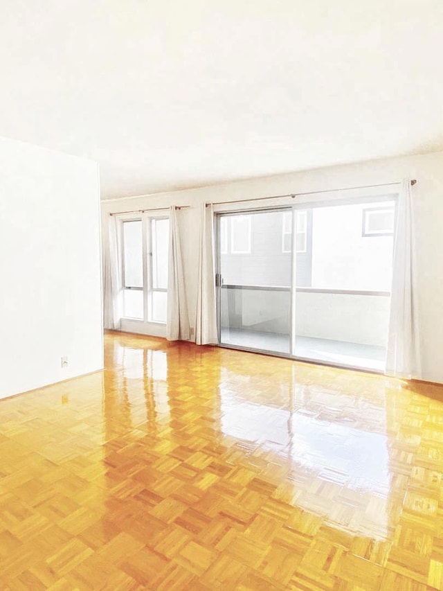 empty room with light parquet flooring