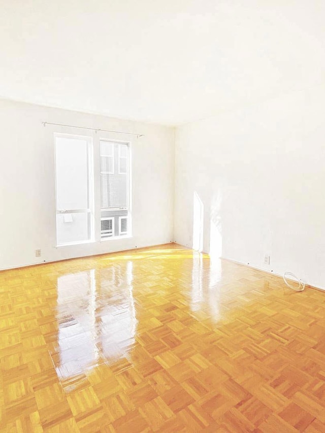 spare room with light parquet floors