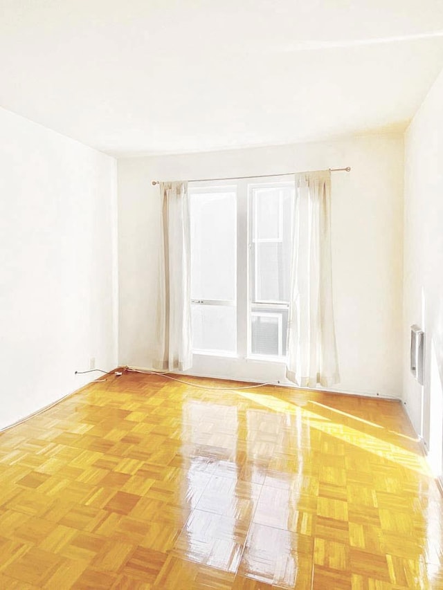 unfurnished room featuring light parquet floors