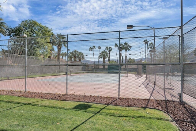 view of community with tennis court