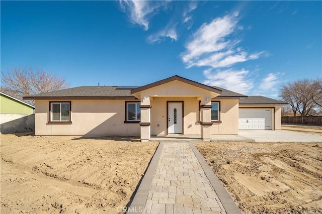 single story home featuring a garage