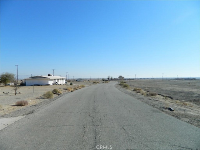 view of street featuring a rural view