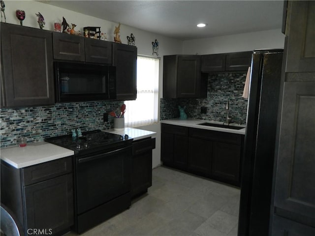 kitchen with sink, backsplash, and black appliances