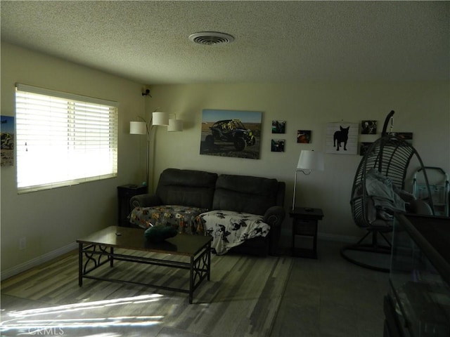 living room with a textured ceiling