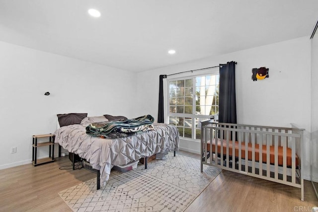 bedroom with wood-type flooring