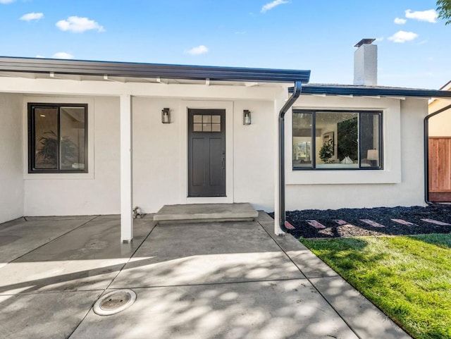 doorway to property featuring a patio area