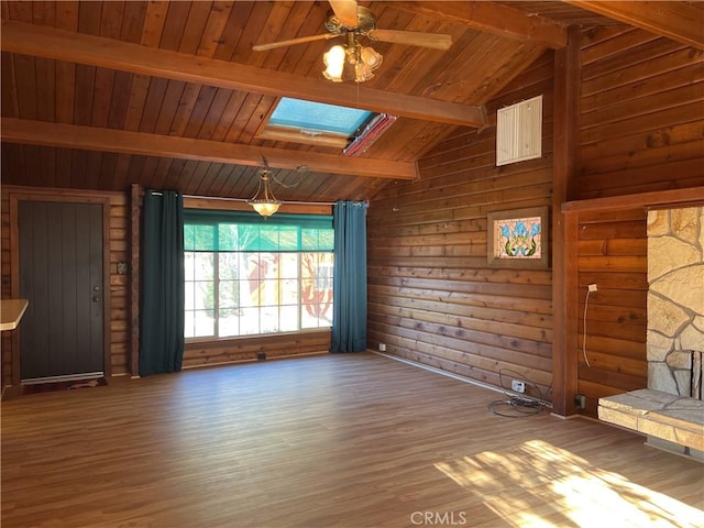 interior space featuring vaulted ceiling with skylight, wood-type flooring, and wood ceiling