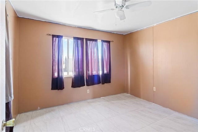 empty room featuring ceiling fan