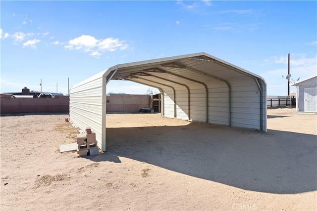 view of vehicle parking featuring a carport