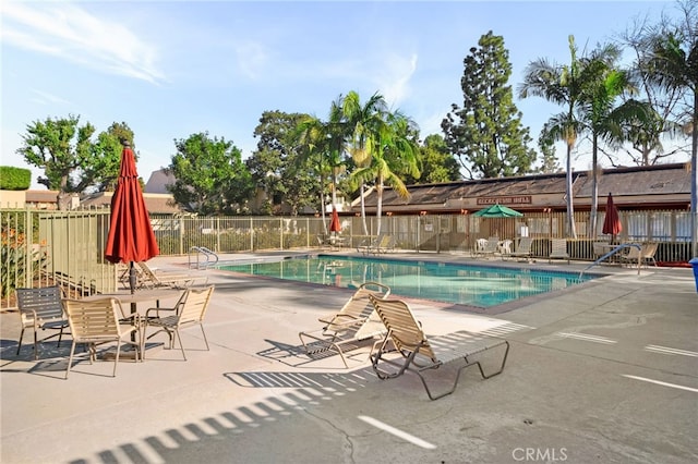 view of swimming pool featuring a patio