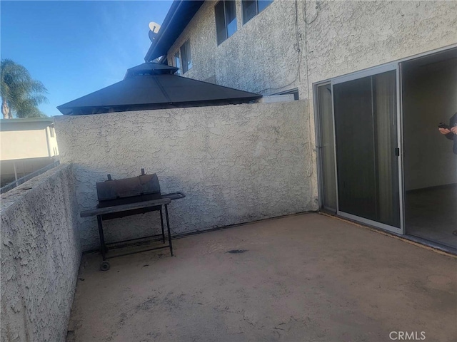 view of patio / terrace featuring a balcony and area for grilling