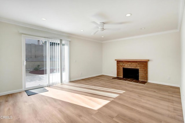 unfurnished living room featuring ceiling fan, light hardwood / wood-style floors, a brick fireplace, and ornamental molding