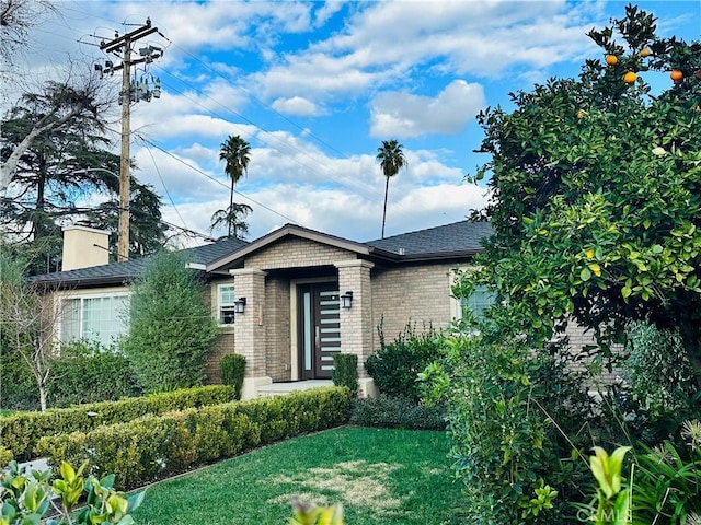 view of front of home with a front yard