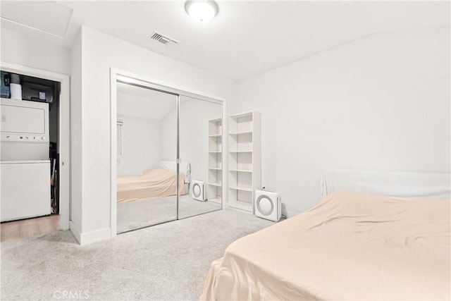 6770 Oak Ave, Arcadia, CA 91007 - carpeted bedroom with stacked washer / dryer, a closet, baseboards, and attic access