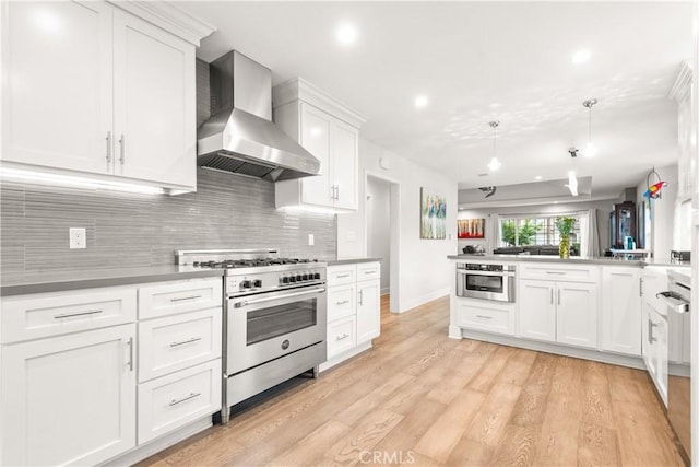 6770 Oak Ave, Arcadia, CA 91007 - kitchen with stainless steel appliances, wall chimney range hood, decorative backsplash, white cabinetry, and recessed lighting