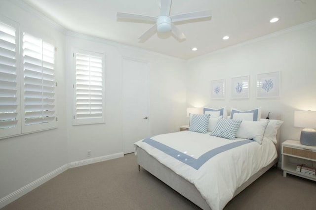 carpeted bedroom featuring ceiling fan and ornamental molding